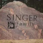 A rock with the word " singer family " on it.