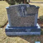 A grave with the name bell on it.