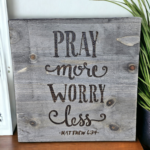 A sign that says pray more worry less