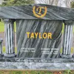A marble grave marker with the name taylor on it.