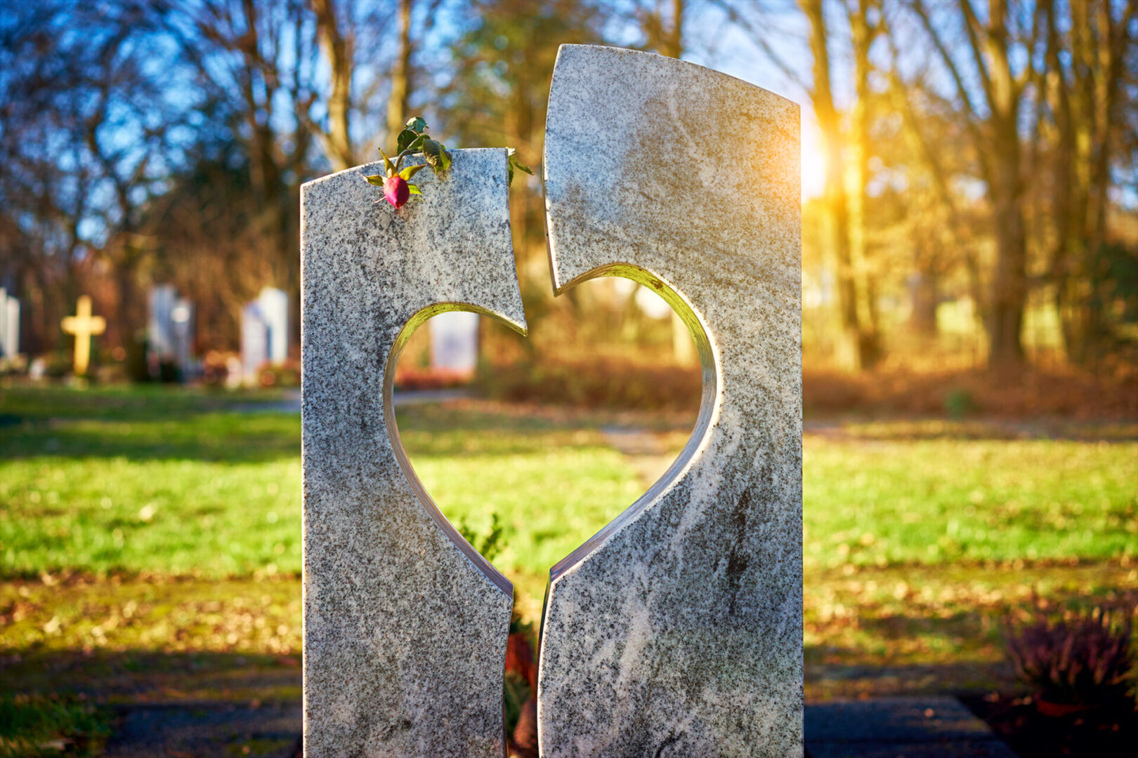 A heart shaped stone with the sun shining through.