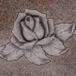 A rose is drawn on the ground with chalk.